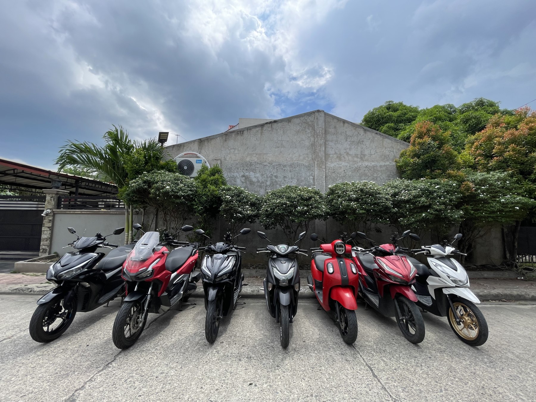 Seven scooters lined up at Two Wheel Ventures CDO